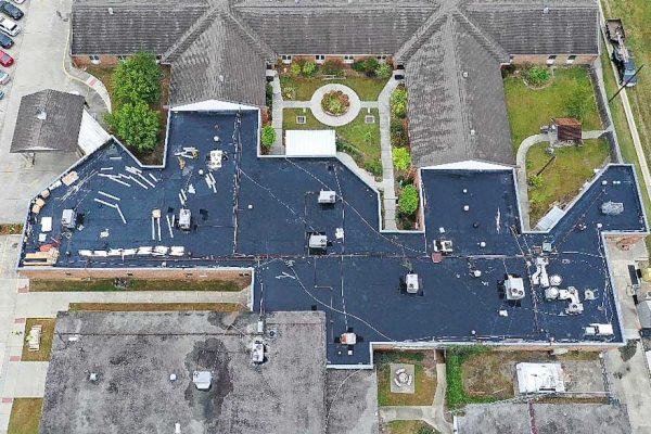 aerial shot of a black roof of a business